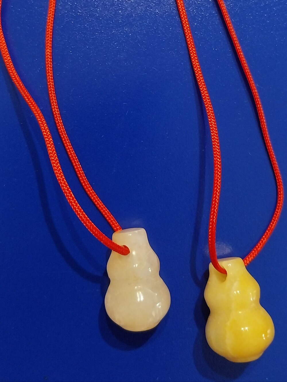 Yellow & Cream Jade Pendants on Red Cord
